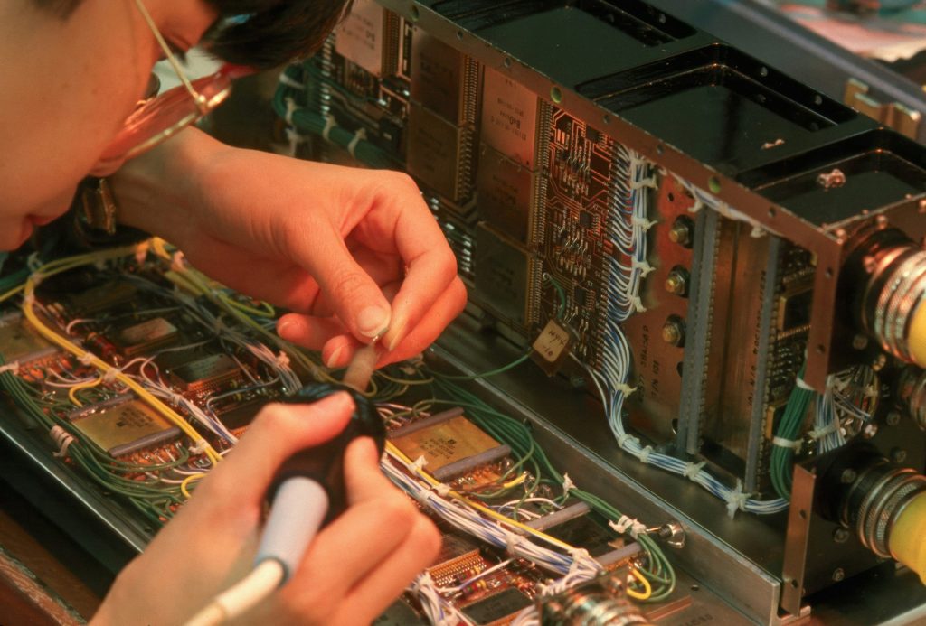 Person soldering electronic components